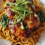 Crockpot Honey Garlic Chicken with noodles served in a bowl