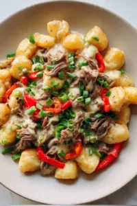 Crockpot Philly cheesesteak potatoes served in a bowl