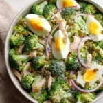 High protein broccoli slice salad with colorful vegetables and dressing