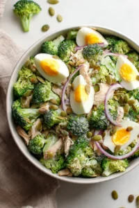 High protein broccoli slice salad with colorful vegetables and dressing