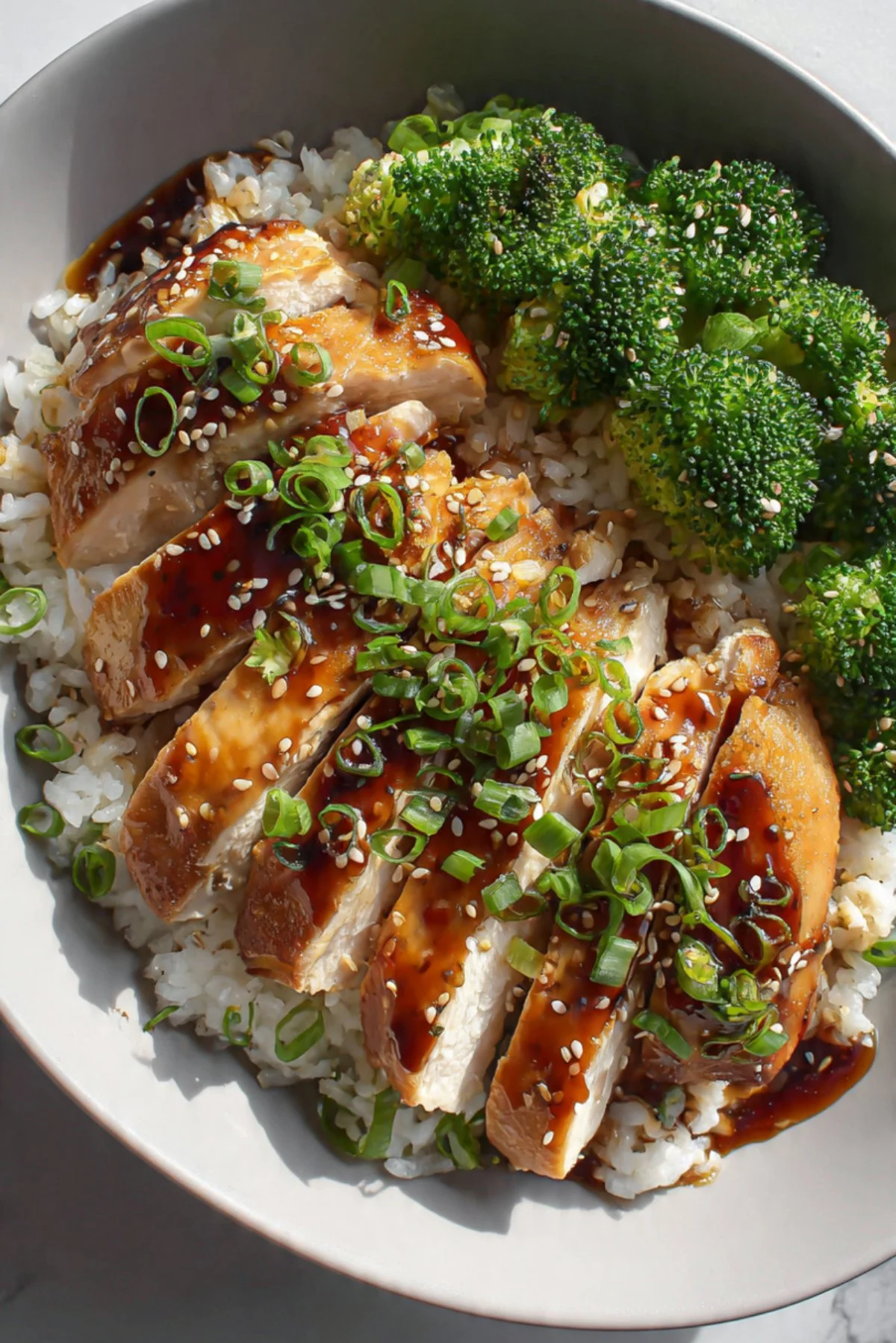 Honey Teriyaki Chicken & Rice Bowls 3 Honey Teriyaki Chicken & Rice Bowls with vegetables and sesame seeds