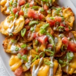 Delicious loaded pickle nachos with cheese and jalapeños