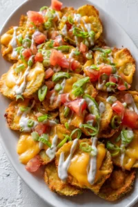 Delicious loaded pickle nachos with cheese and jalapeños